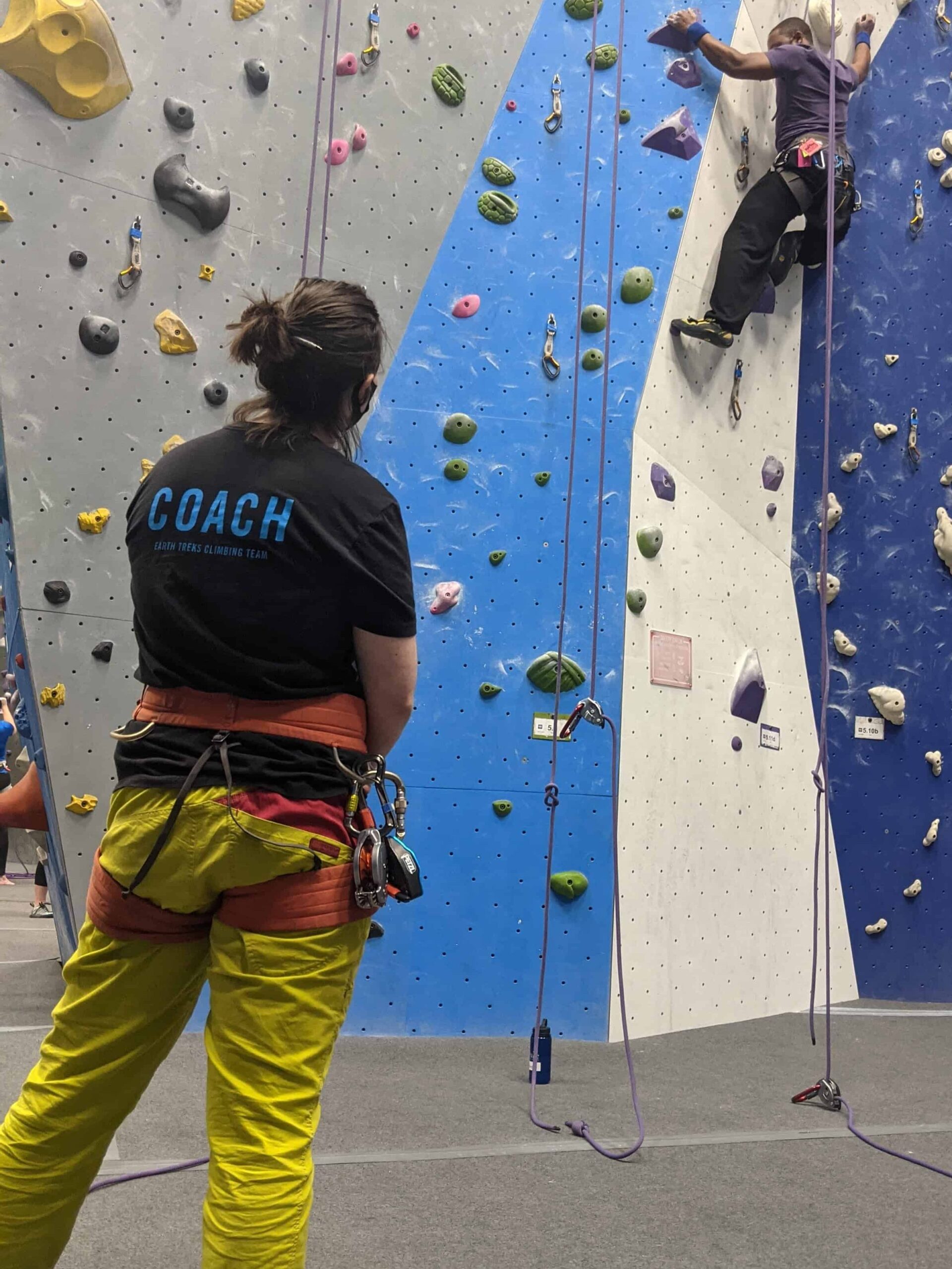 coaching Wendy coaching a client rock climbing